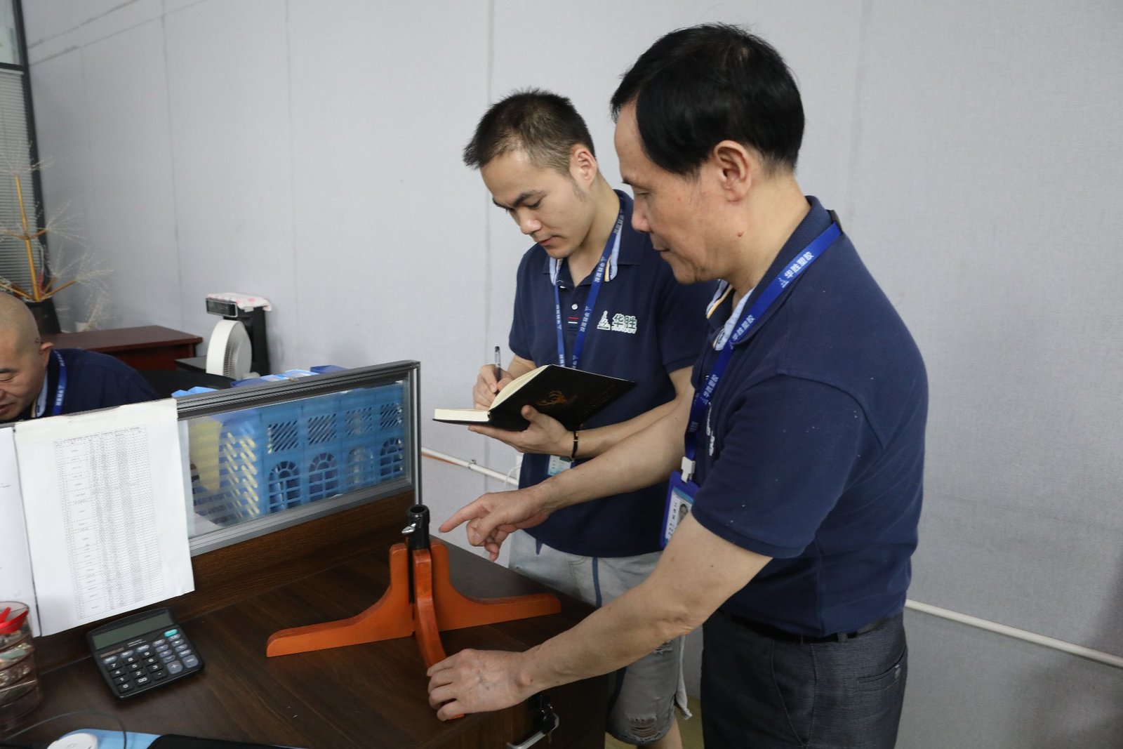 R&D engineers reviewing sample parameters